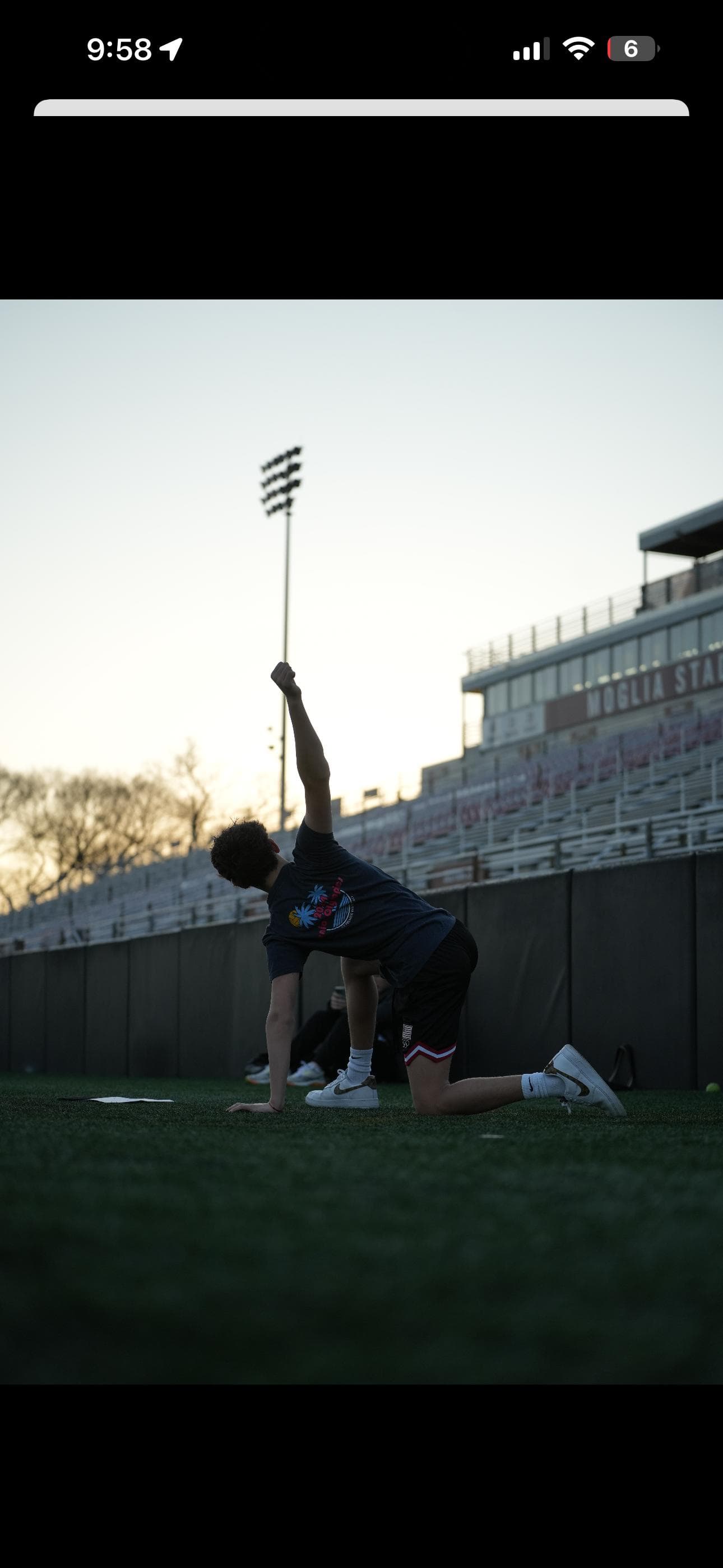 Teresa's athlete training on a field at sunset